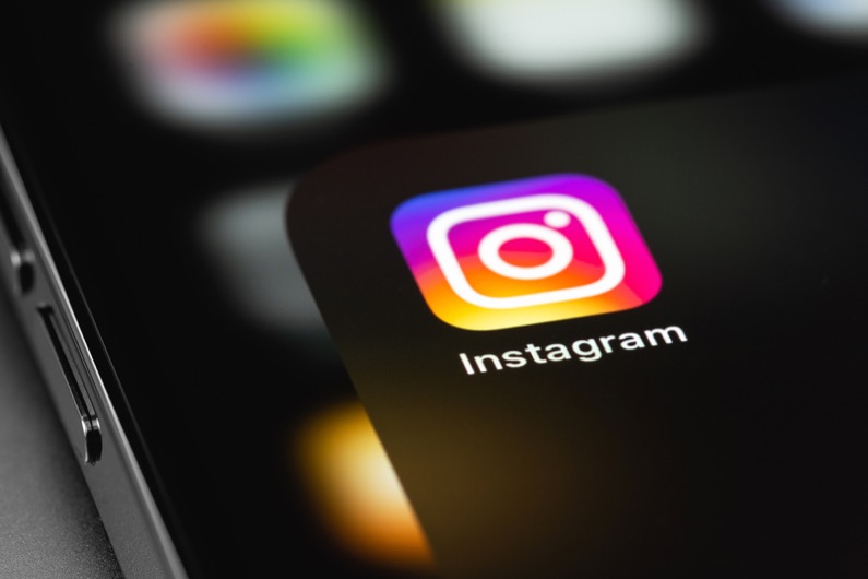 Instagram mobile app on screen smartphone iPhone, macro icon app. Instagram is a photo-sharing app for smartphones.