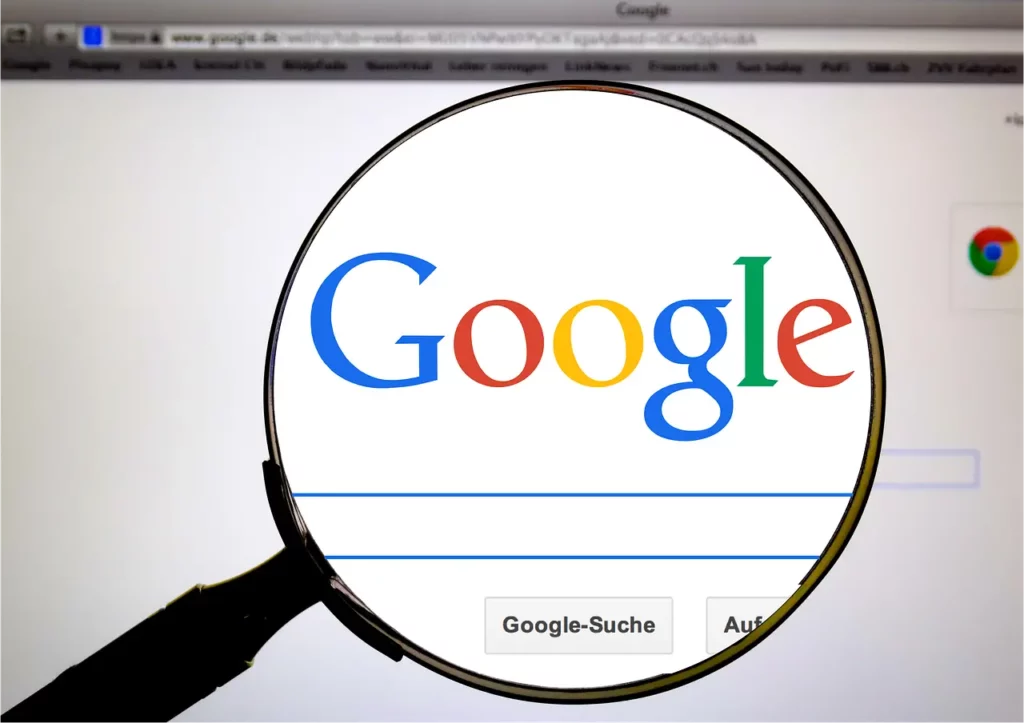 magnifying glass over screen with google page