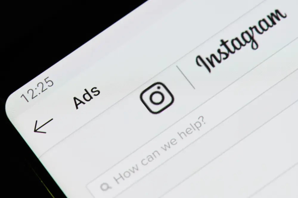 Create instagram ads application on digital screen macro close up view