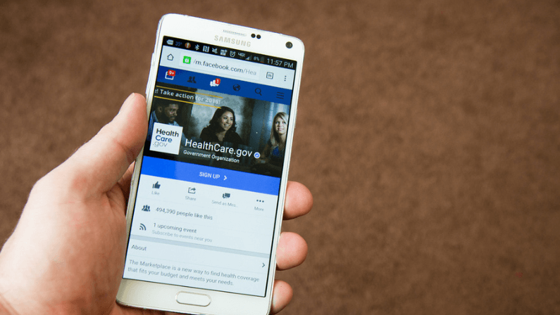 Person looks at the healthcare.gov Facebook page on their mobile device in Caldwell, Idaho