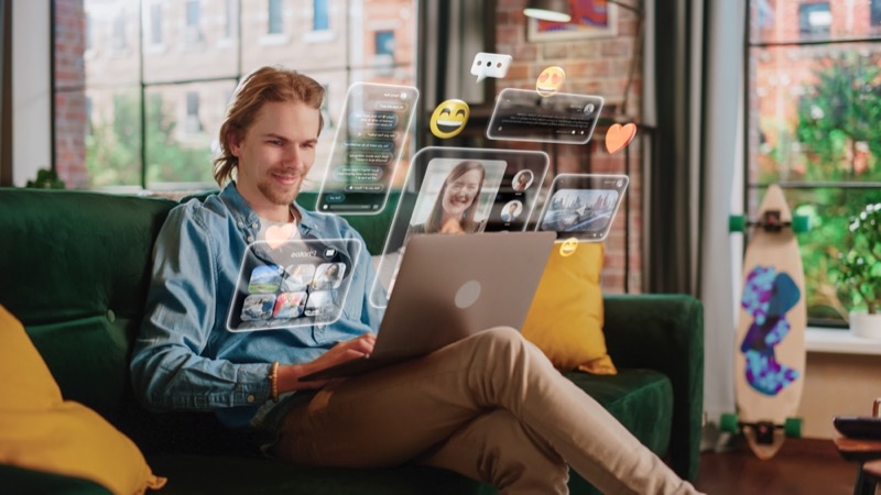 Young Handsome Man Using Laptop Computer To Check Social Media