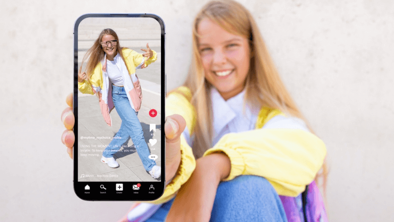 Teenage girl showing mobile phone with sample video content shared on social media