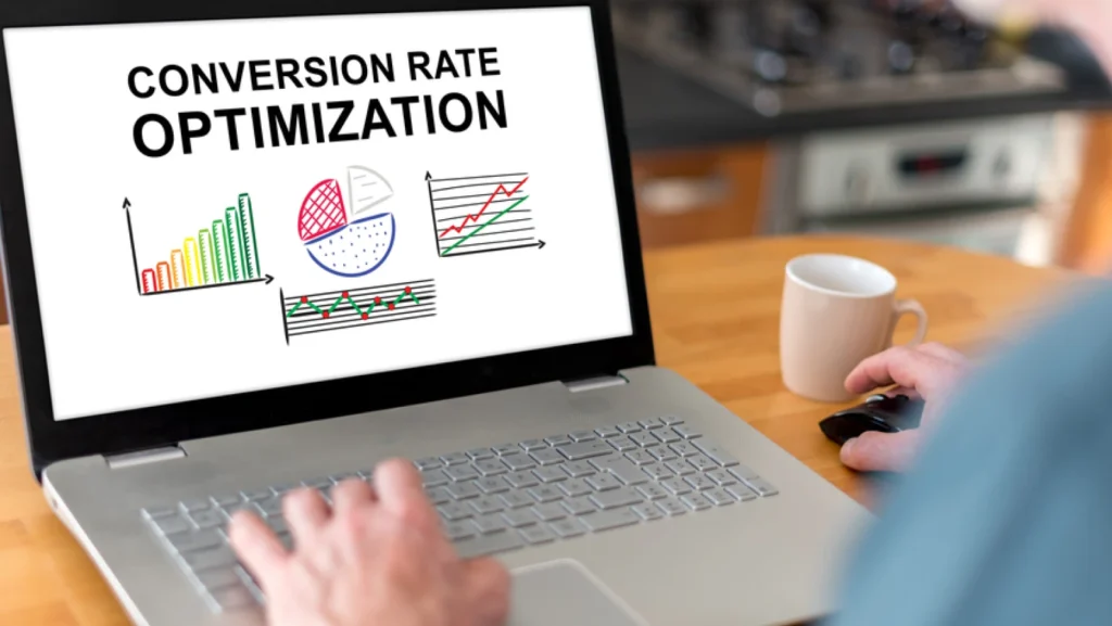 Man using a laptop with a conversion rate optimization concept on the screen