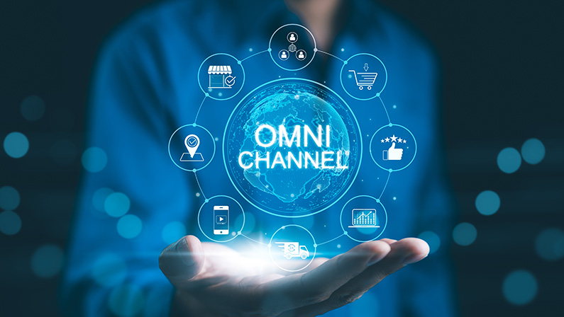 Omni Channel Marketing Concept. Businessman holding digital representation of omni-channel marketing, e-commerce, delivery, social media, analytics, customer engagement, and customer service icons.