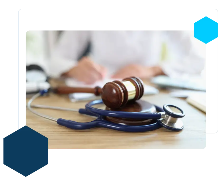 wooden gavel on table with doctors in the background