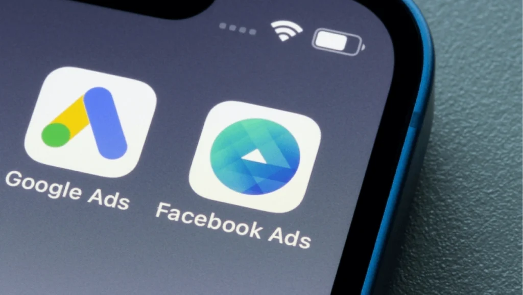 Portland, OR, USA - Dec 9, 2021: Facebook Ads Manager and Google Ads app icons are seen on an iPhone. Big tech ad businesses concept.