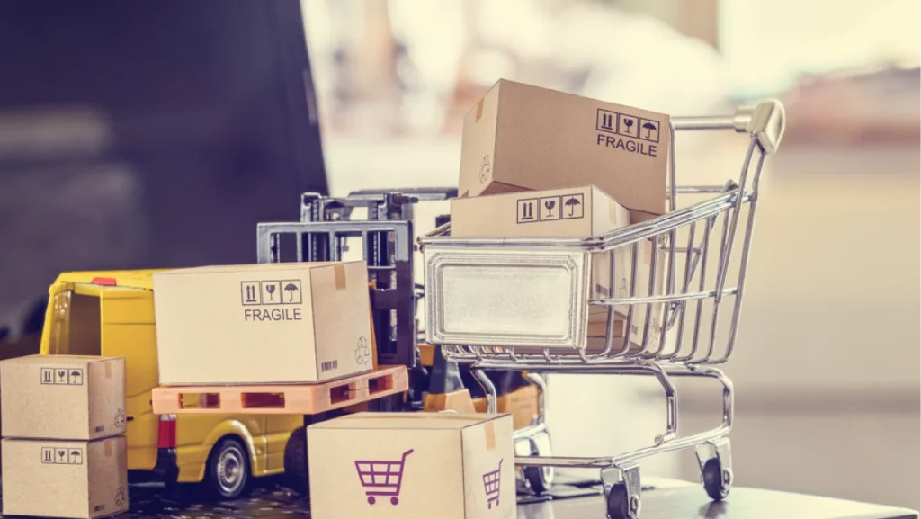 Logistics, supply chain and delivery service for e-commerce, online shopping concept : Boxes, shopping cart, fork-lift truck, delivery van on a laptop computer, depicts using internet to order goods