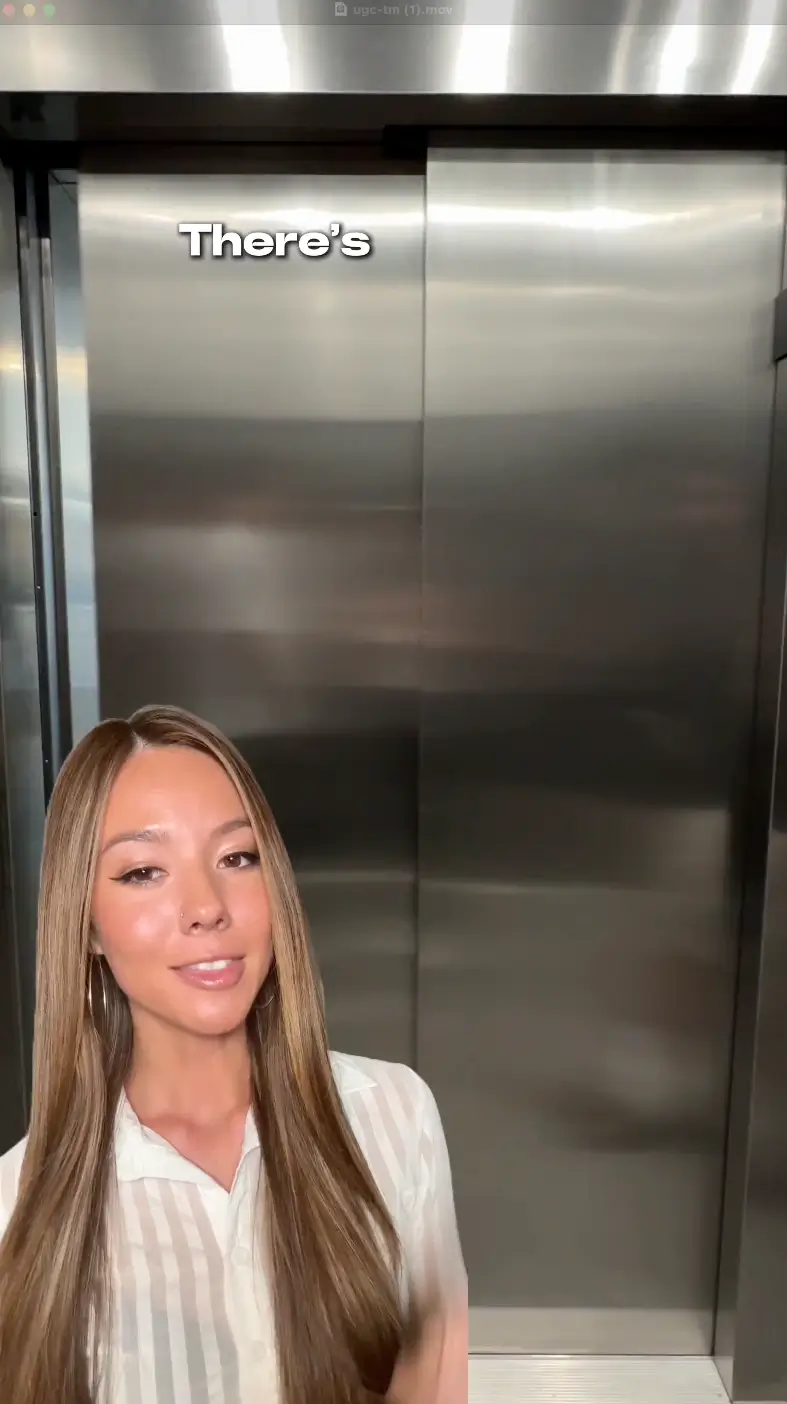woman talking in front of elevator