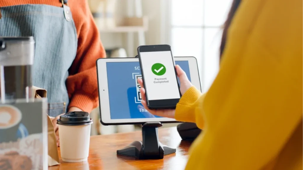 QR code payment, customer using smartphone for paying at shop