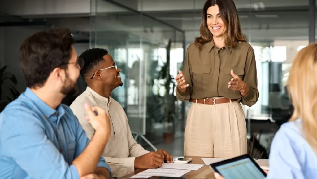 Business woman discussing with diverse colleagues at the office