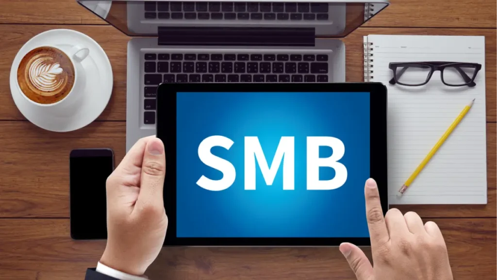 SMB - Small and Medium-Sized Business, on the tablet pc screen held by businessman hands