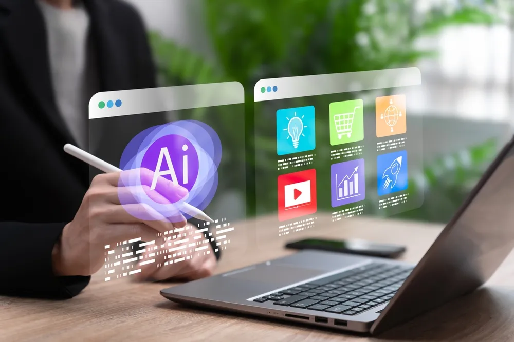 A businessman interacts with a laptop displaying a virtual AI interface, focused on his work.