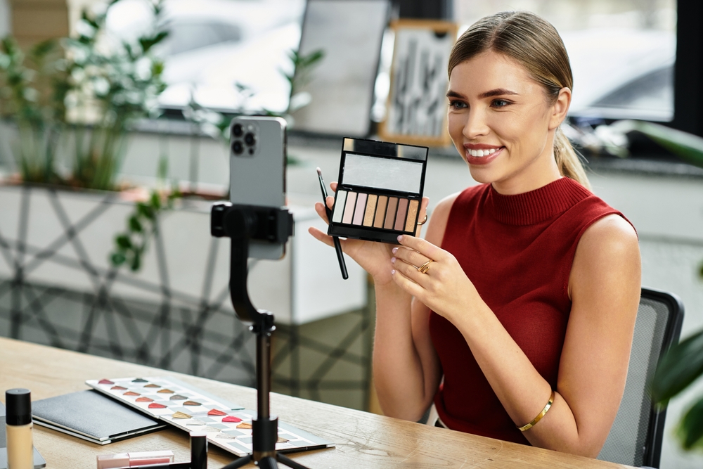 Young beauty influencer showcases her must-have make-up products using her phone