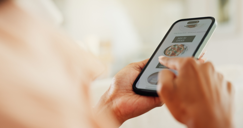 Person, scroll and phone screen in hands for meal order, ecommerce