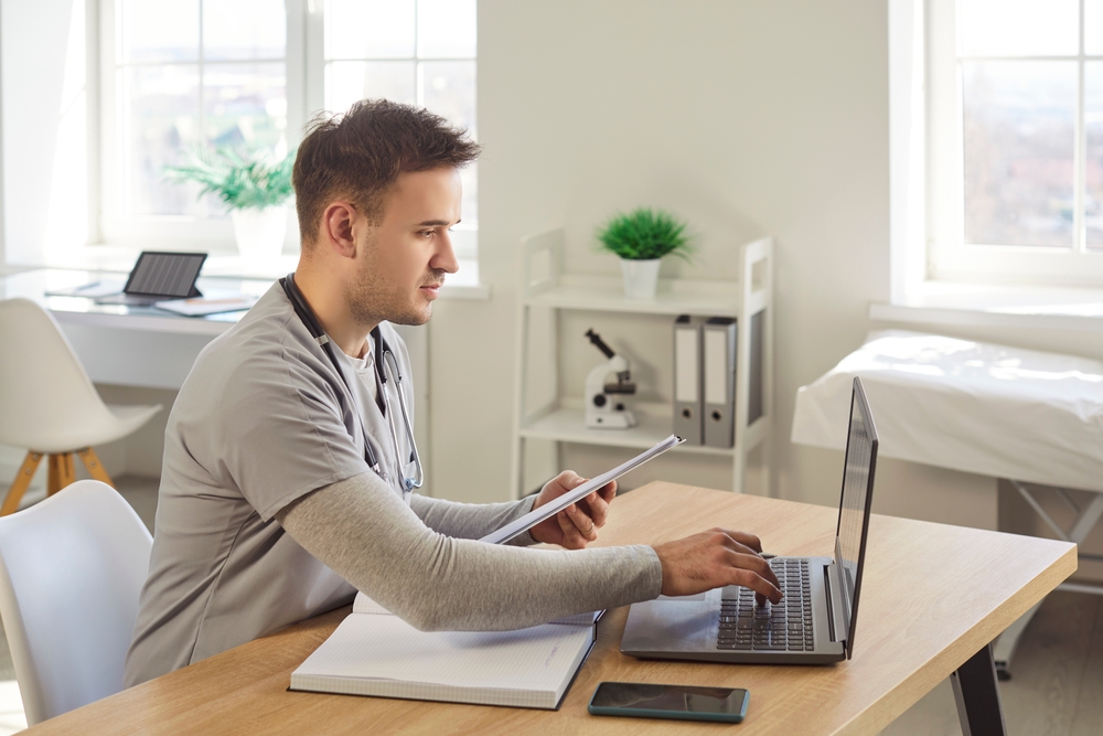 Portrait of a young male doctor or nurse in medical uniform
