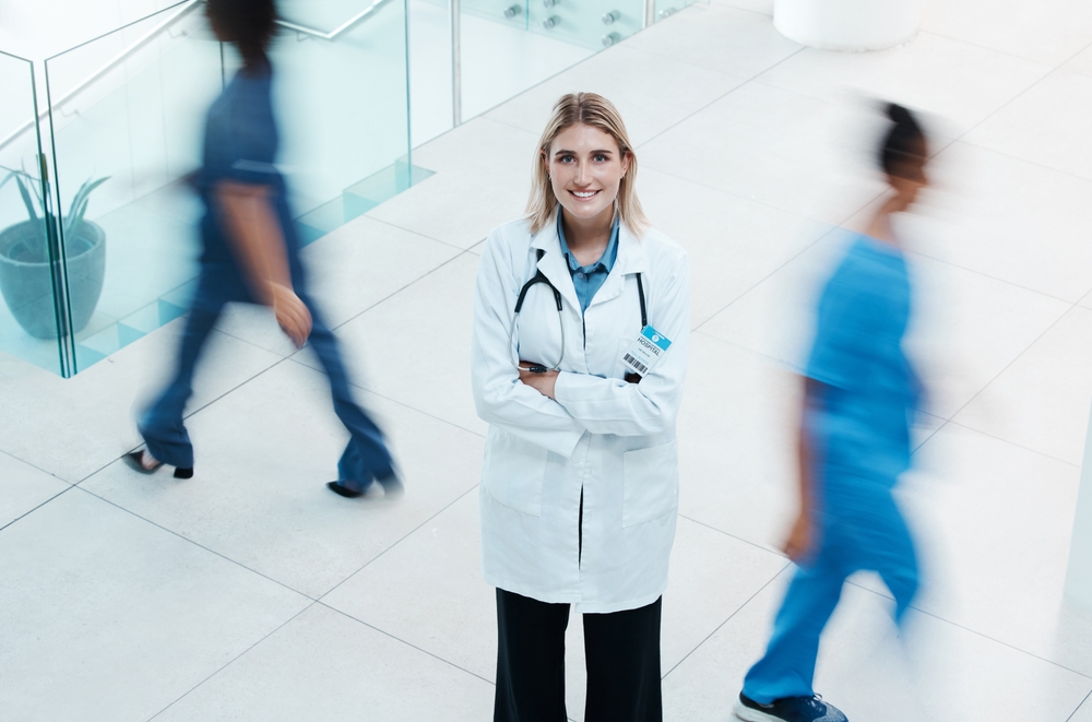 Busy, healthcare and doctor woman in hospital portrait for leadership,