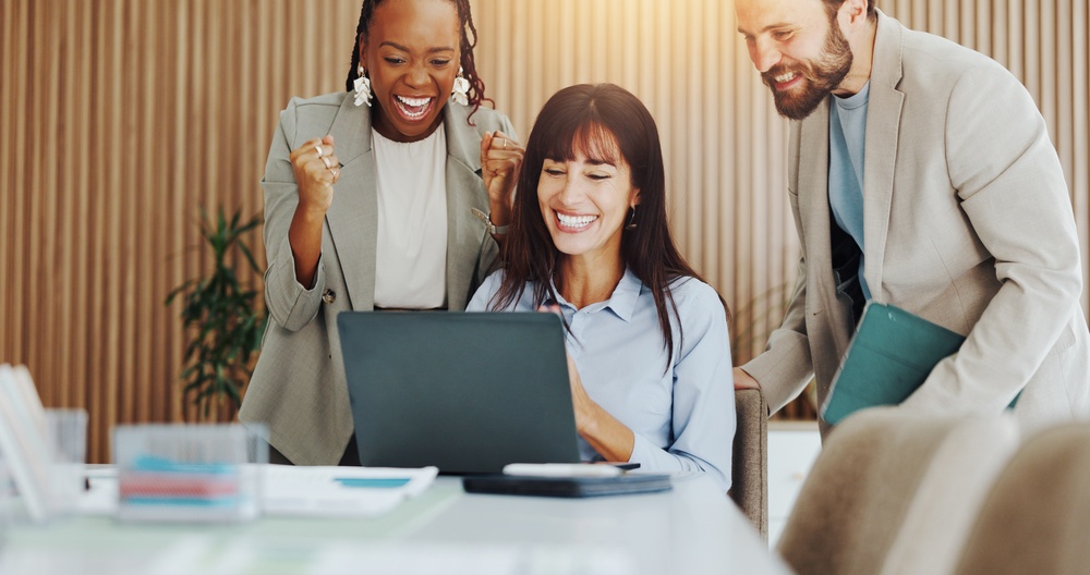 Laptop, team or excited with fist pump at agency for ad pitch approval