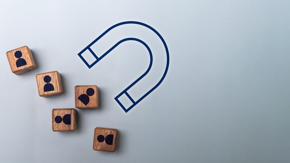 Customer attraction and lead generation concept with a magnet pulling