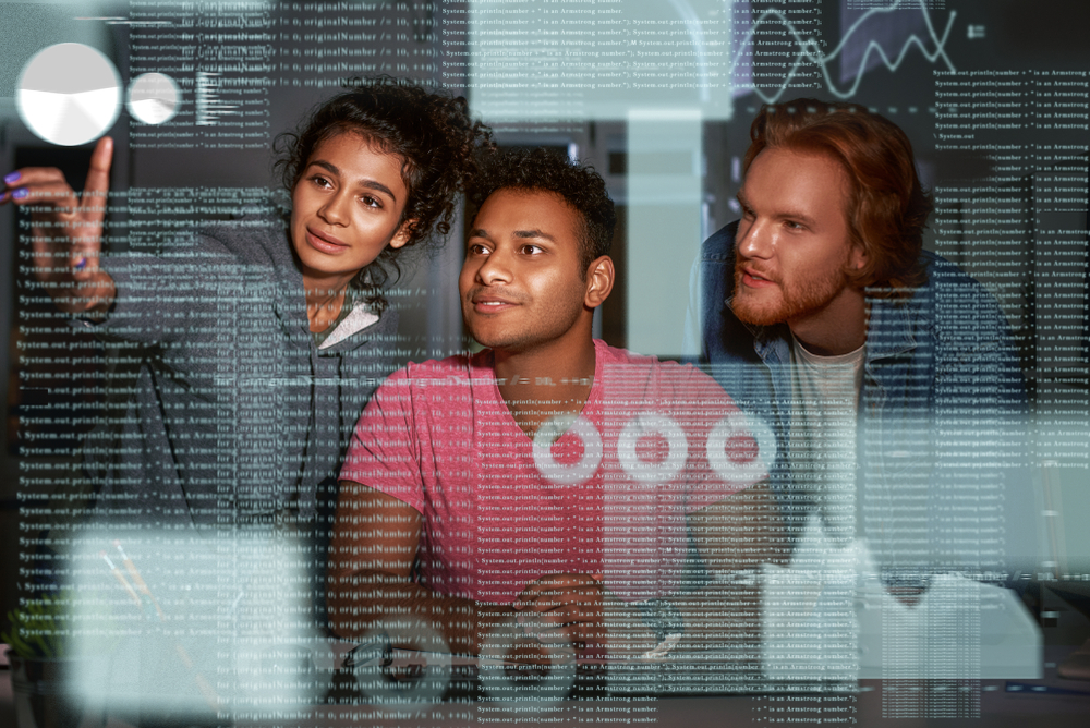 Young team of data analysts are going through endless data streams