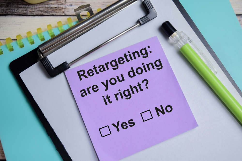 Retargeting are you doing it right write on sticky notes isolated on Wooden Table