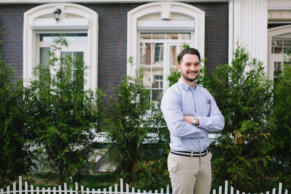 smiling man outsite a rental property
