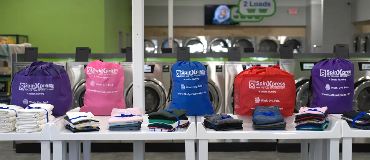 spinxpress laundry bags and folded clothes