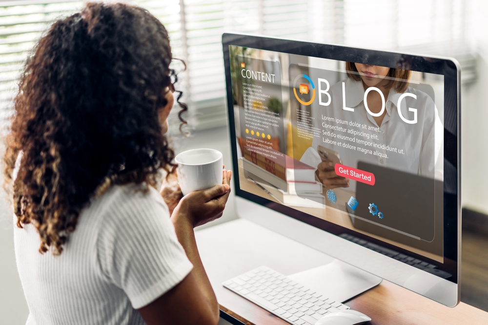 Woman use laptop computer with social media online content, freelance worker