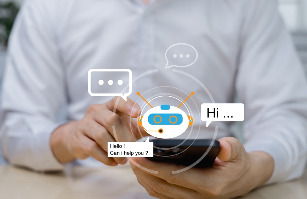 Businessman talking to a digital assistant chatbot on his mobile via internet application