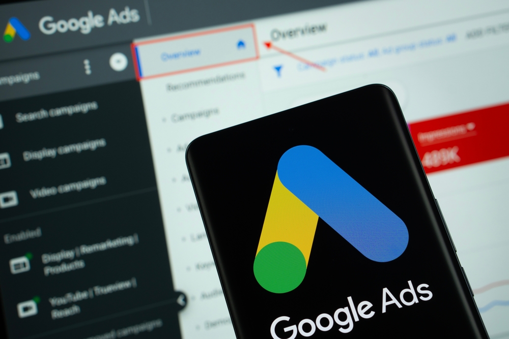 Google Ads logo is displayed on a smartphone screen