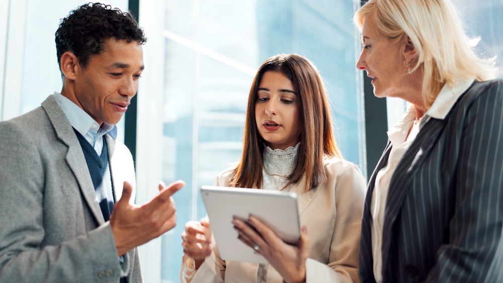 Business people, lawyer or conversation in office with tablet for advocacy, legal case or manager advice.