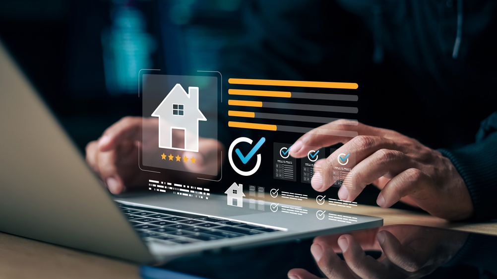 Customer reviewing online property rating and home evaluation on laptop. 