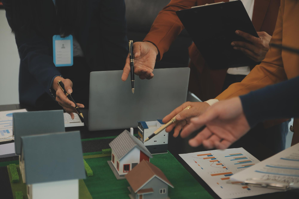 Team of architectures and businessmen discussing