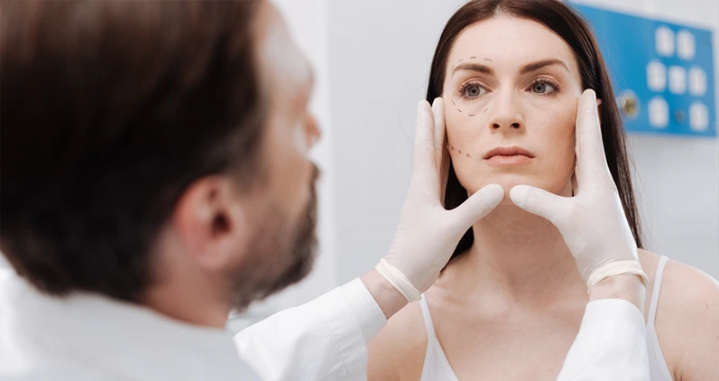 Professional plastic surgeon defining the volume of work