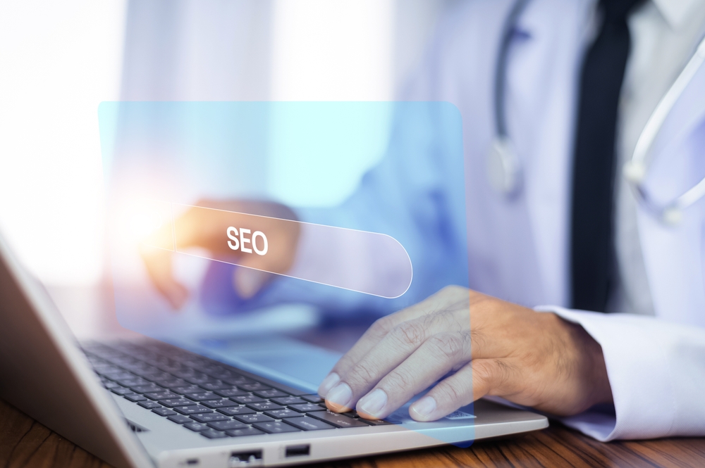 A man using laptop with search engine optimization concept