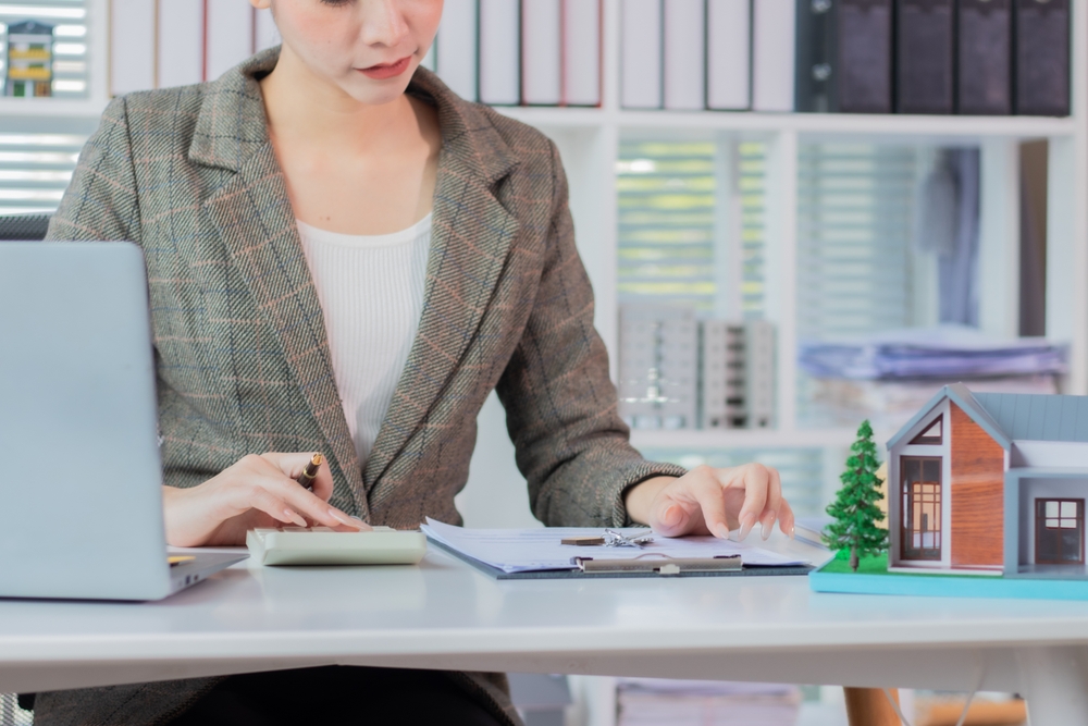 Real estate agents who present home designs to potential clients.
