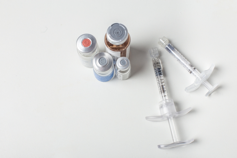 Glass medicine bottle and botox, with two syringe