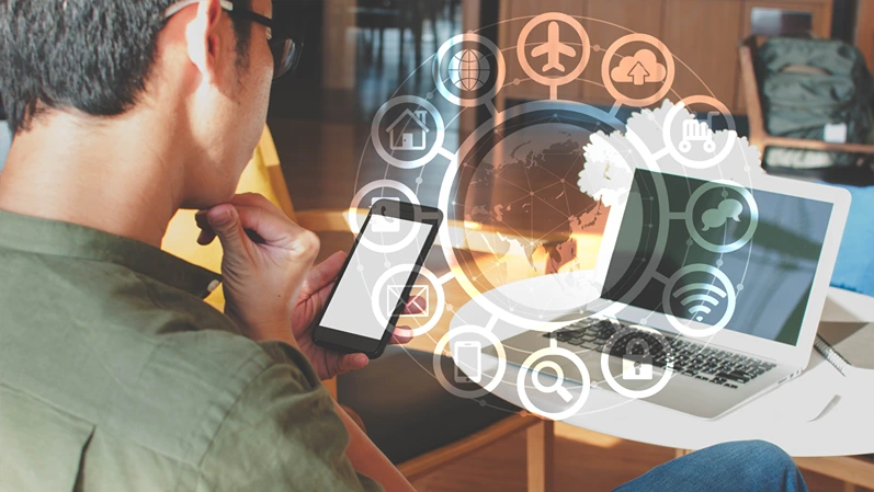 A man using smartphone with IOT, internet of things conceptual sign, internet era, internet in every day lifes