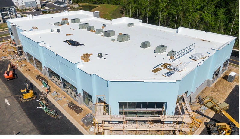 Drone Images of TPO Commercial Roof With Some Metal Panels and a Clock Cupola