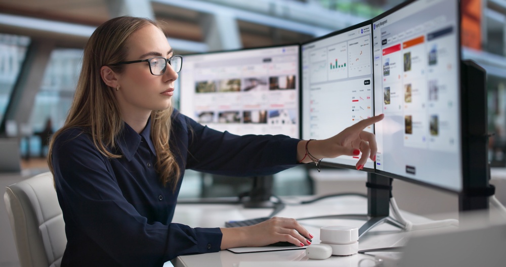 Woman Property Manager Uses Software Dashboard To Track Rental Income.