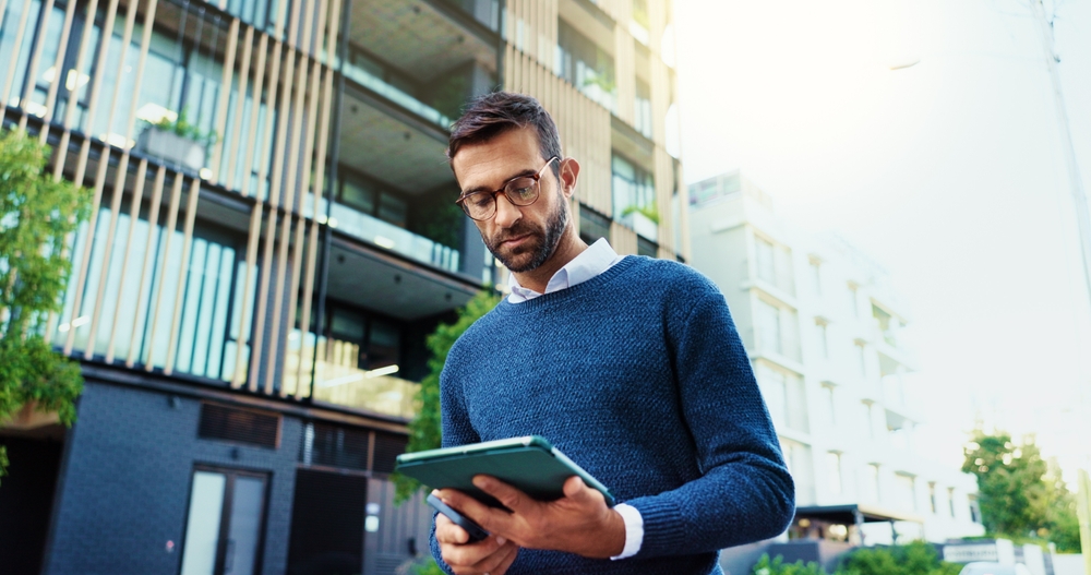 Urban, male person and real estate agent with digital for online review