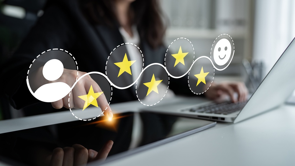 Businesswoman engaged with a digital tablet showcases customer feedback 