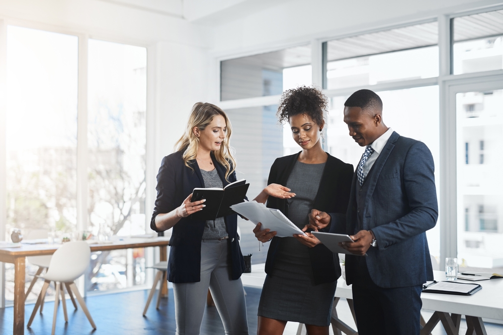 Attorney, teamwork and documents with business people in office