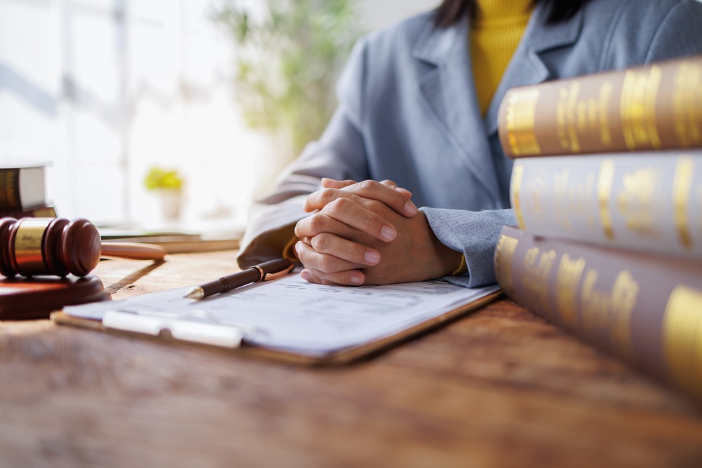 Lawyers Consultation and conference discussing legal matters at a desk with a gavel
