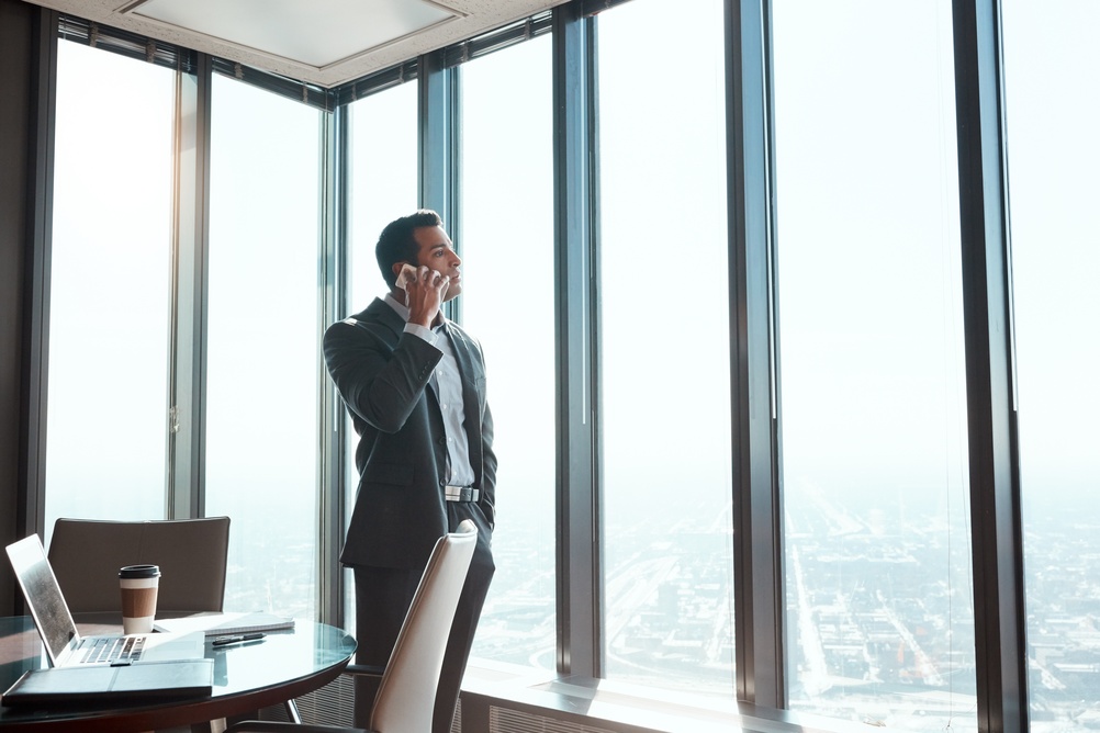 Businessman, lawyer and talk in office with phone call