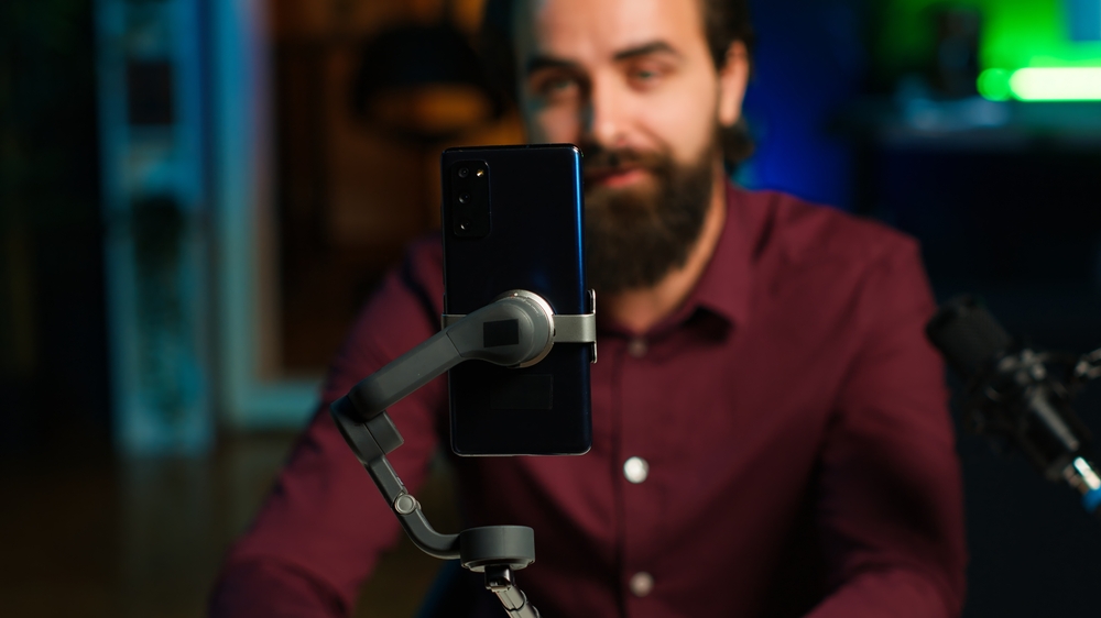 influencer in home studio recording live broadcast for online streaming platforms