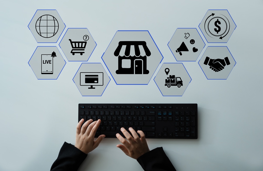 Hands Typing on a Keyboard Surrounded by E-commerce Icons Representing Digital Marketing