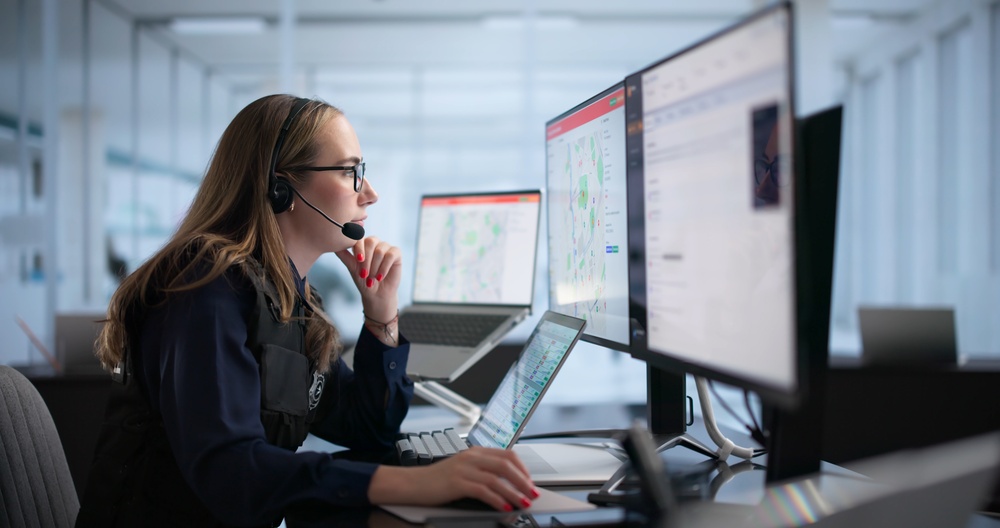 Young Woman In Emergency Center Swiftly Answers Urgent SOS Call.