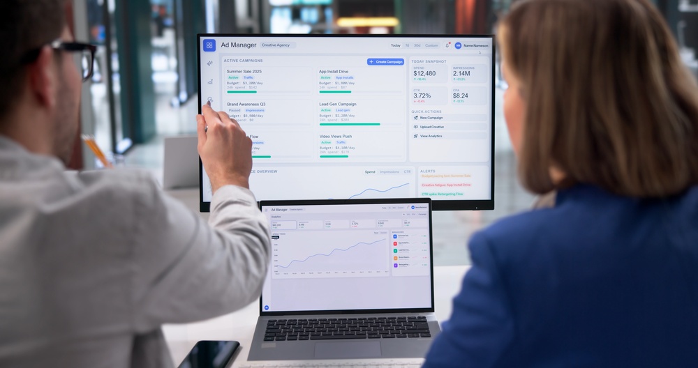 Digital Marketing Strategist Reviews Campaign Analytics On Laptop