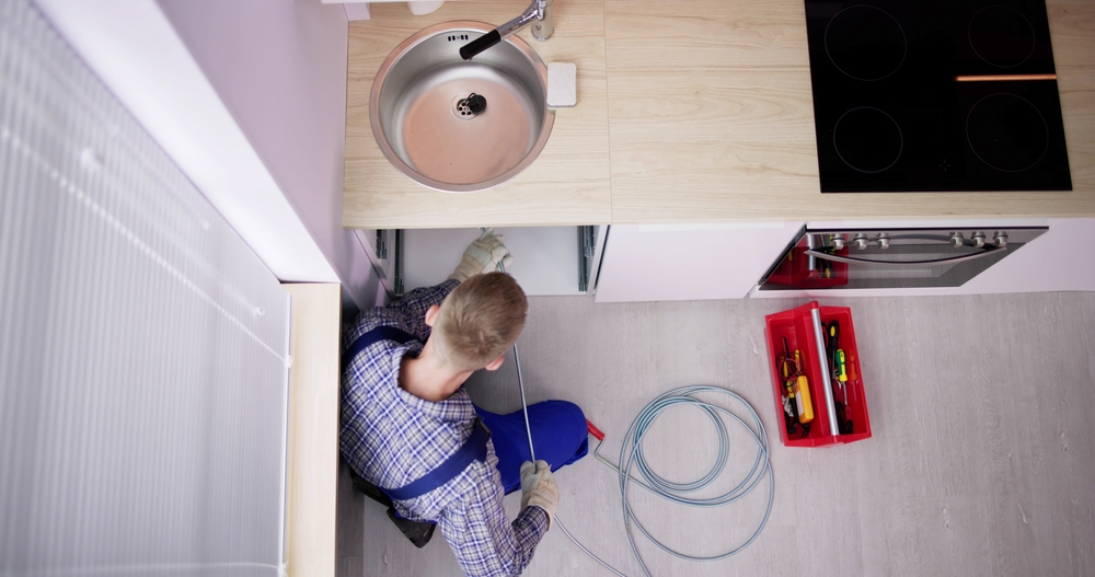 Plumber Drain Cleaning Services In Kitchen. Unclog Blocked Pipe